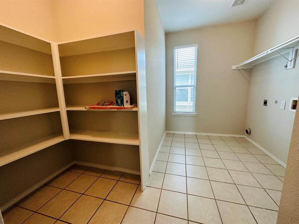 9701 Meadow Rue Drive McKinney, TX 75072 - Photo 12 of 24 a view of an empty room with a window