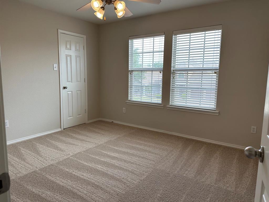 9701 Meadow Rue Drive McKinney, TX 75072 - Photo 20 of 24 a view of an empty room with a window