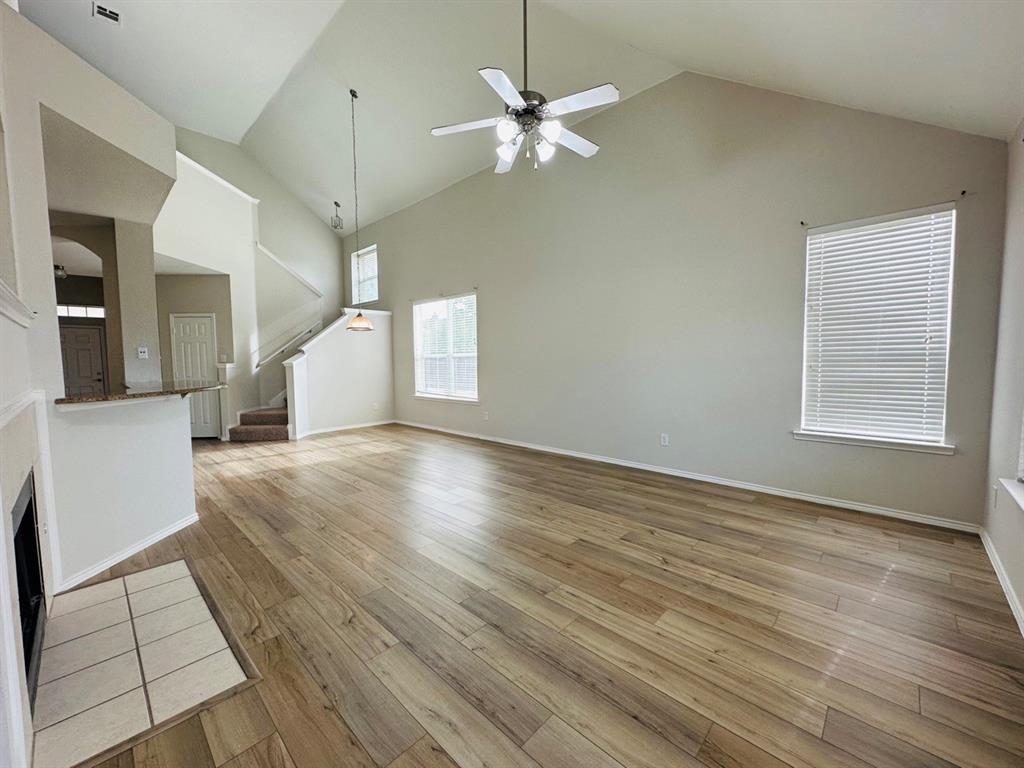 9701 Meadow Rue Drive McKinney, TX 75072 - Photo 2 of 24 wooden floor in an empty room with a window