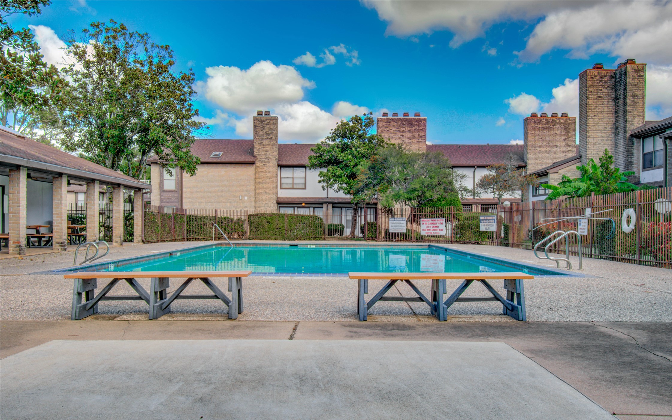 6633 West Airport Boulevard, Unit 1008 Houston, TX 77035 - Photo 6 of 8 a view of a bench and chairs in the patio
