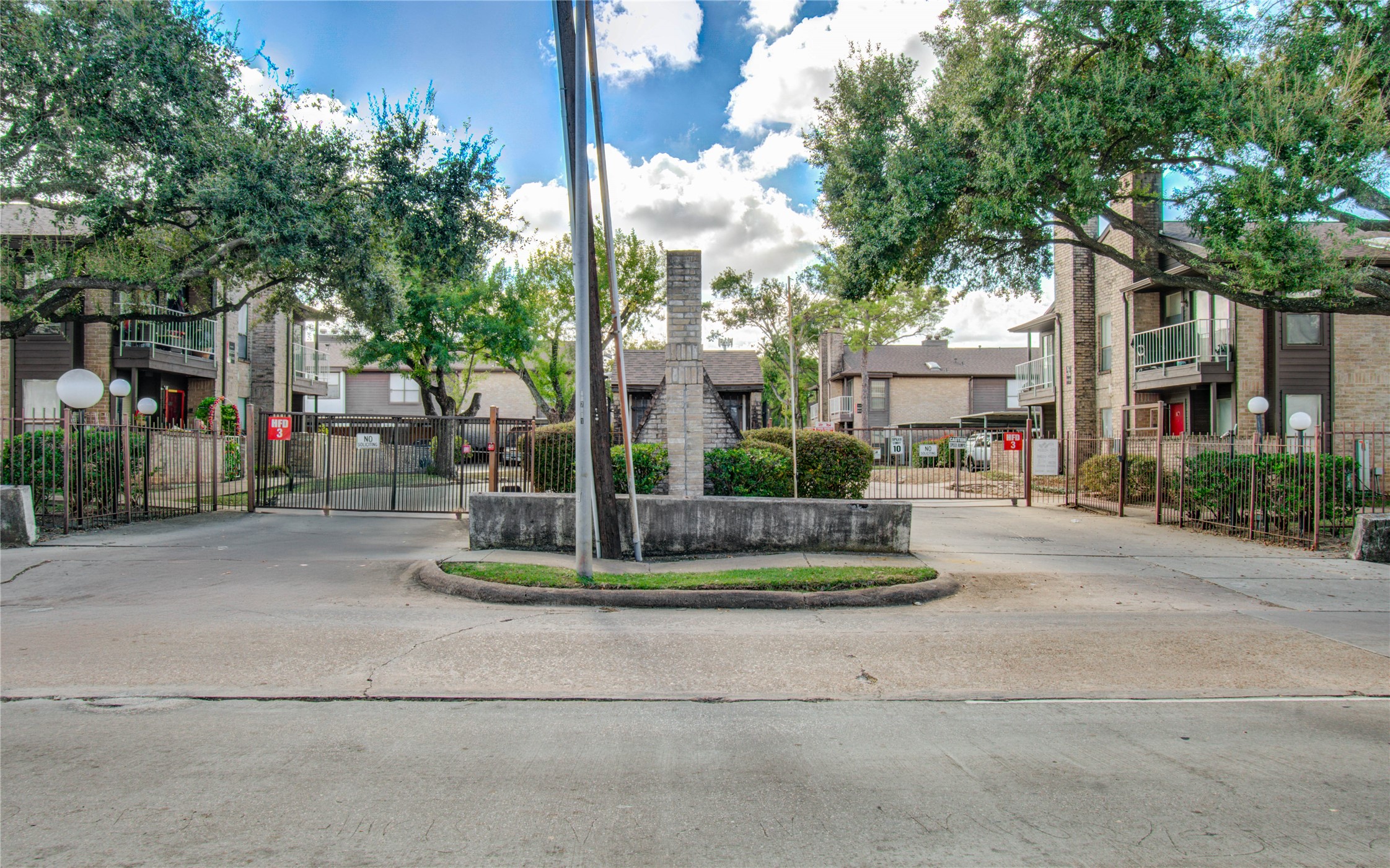 6633 West Airport Boulevard, Unit 1008 Houston, TX 77035 - Photo 7 of 8 a building with trees in front of it