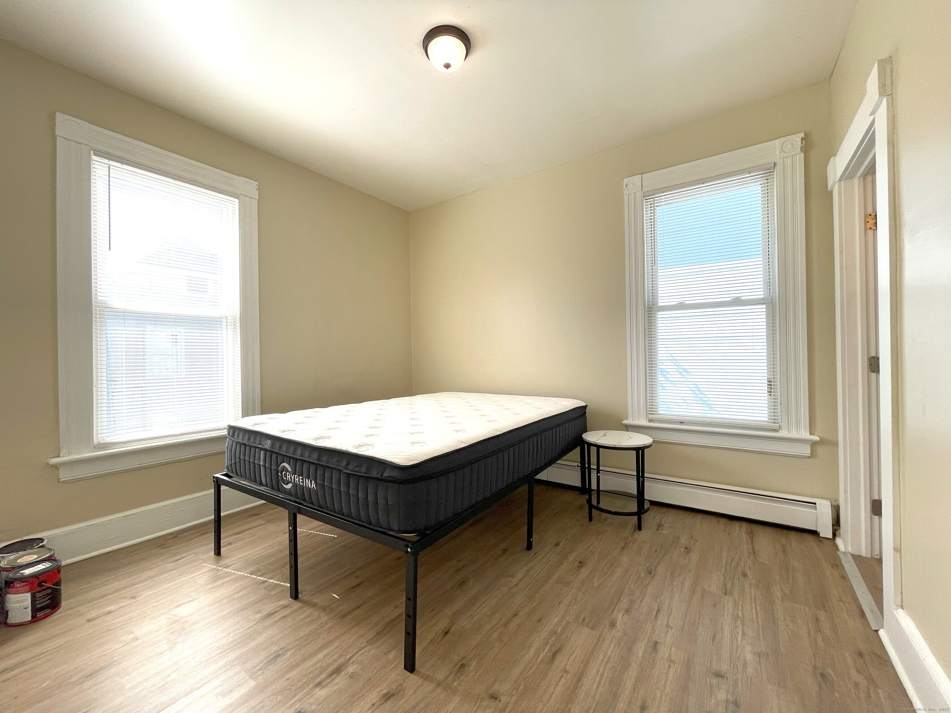 196 Blatchley Avenue, Unit 2 New Haven, CT 06513 - Photo 3 of 7 a room with wooden floor and windows