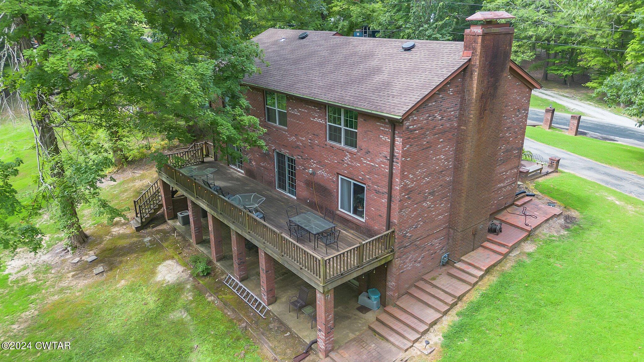 93 Lohrig Road Jackson, TN 38301 - Photo 23 of 27 a aerial view of a house with a yard