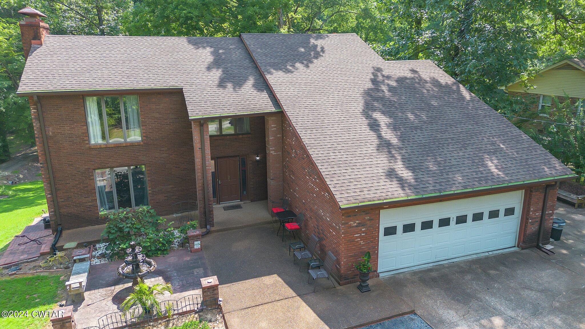 93 Lohrig Road Jackson, TN 38301 - Photo 3 of 27 a view of a house with a yard potted plants