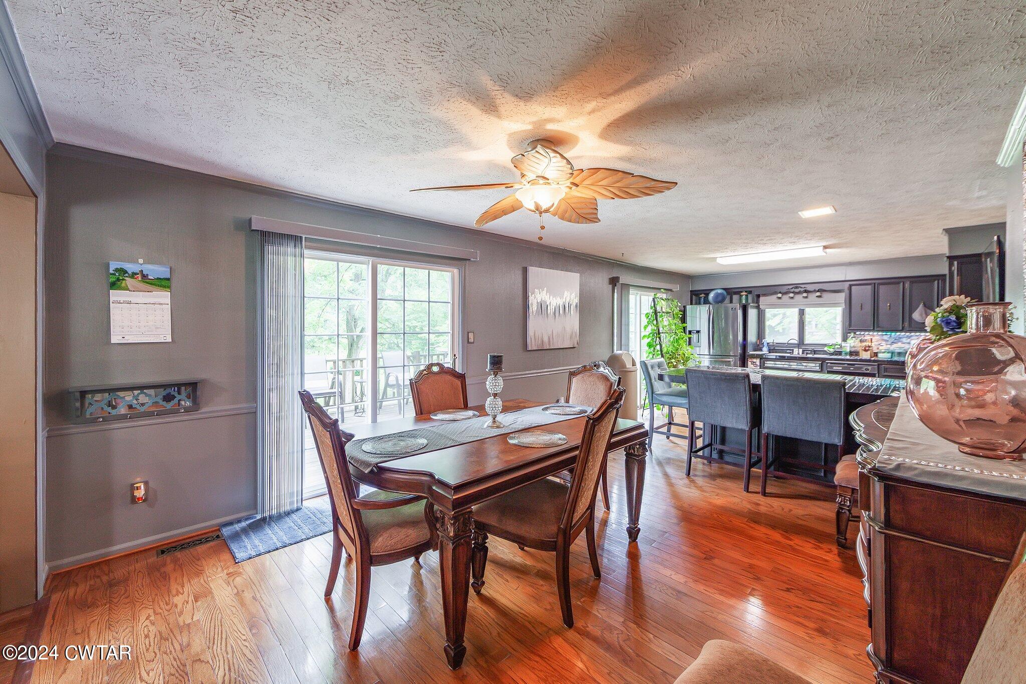 93 Lohrig Road Jackson, TN 38301 - Photo 8 of 27 a view of a dining room with furniture window and wooden floor