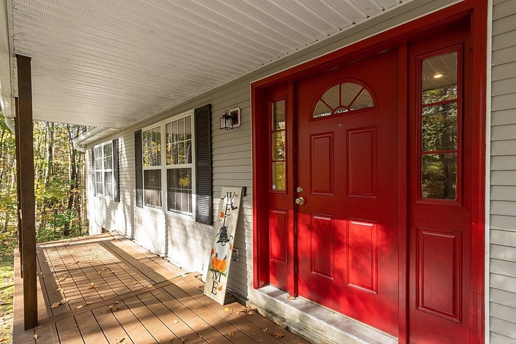 191 Popple Camp Road Petersham, MA 01366 - Photo 4 of 36 a view of front door with a red door and a porch