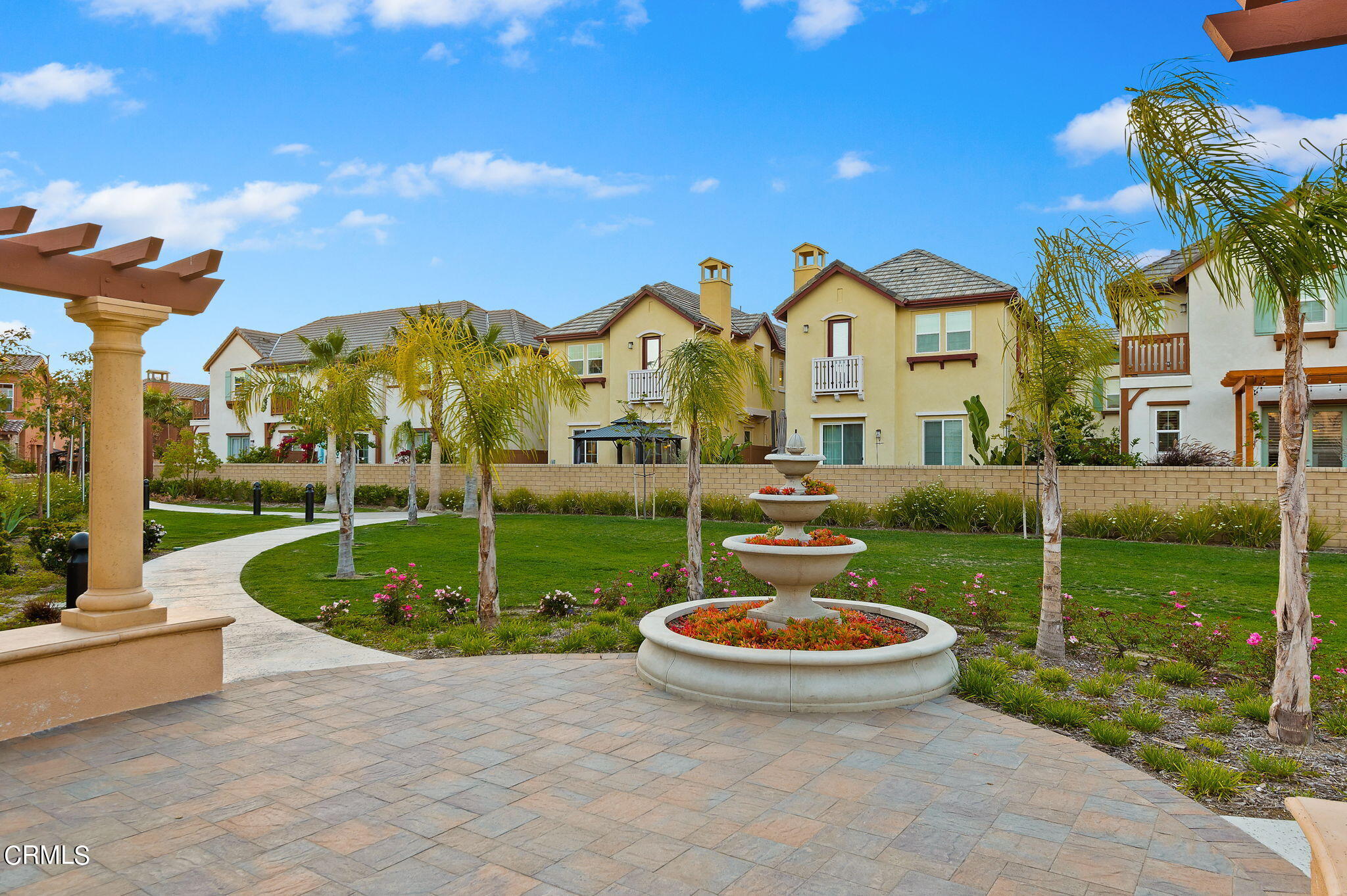 2355 Nicklaus Street Oxnard, CA 93036 - Photo 39 of 46 a view of a white house with a yard and potted plants