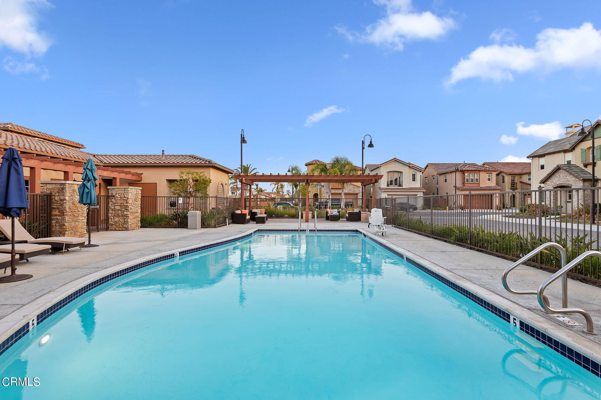 2355 Nicklaus Street Oxnard, CA 93036 - Photo 42 of 46 a view of a swimming pool with chair and tables