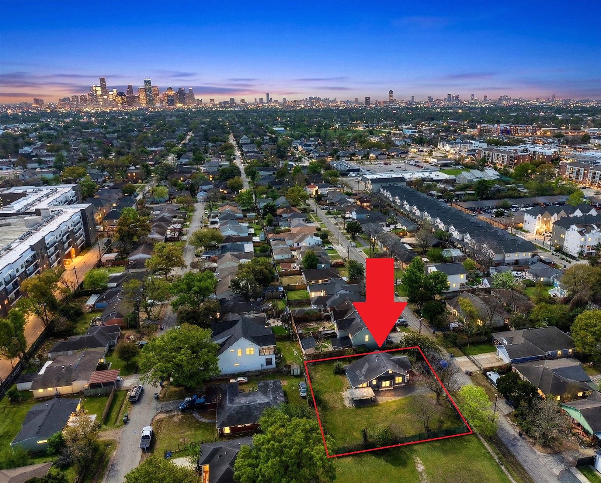 an aerial view of residential houses with outdoor space