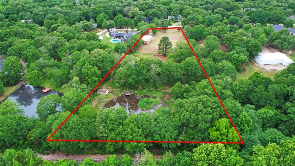 380 Timber Lakes Drive Powderly, TX 75473 - Photo 12 of 19 an aerial view of a house