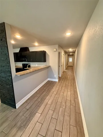 a view of a kitchen with a sink and microwave