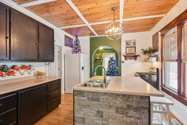 a large kitchen with a chandelier