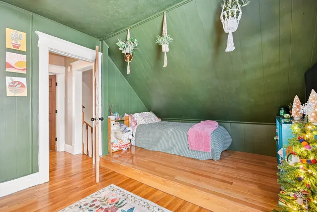 a bedroom with a bed and a dresser