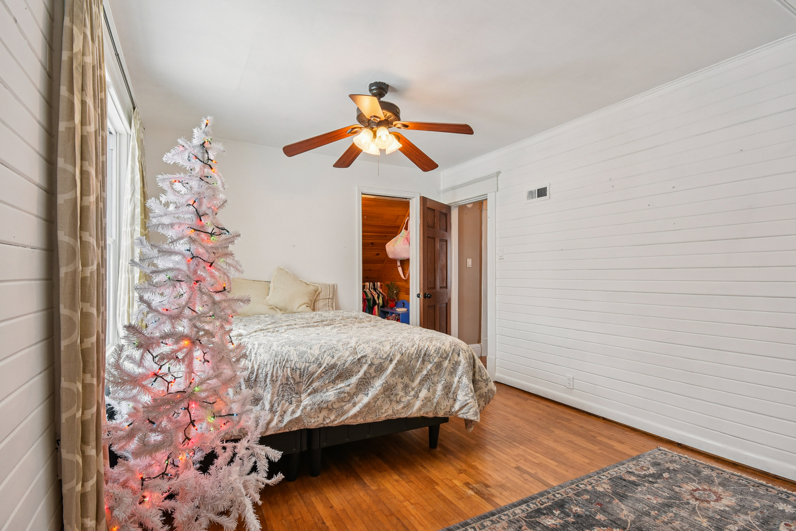 609 East Chapin Street Morris, IL 60450 - Photo 21 of 36 a bedroom with a bed and a chandelier