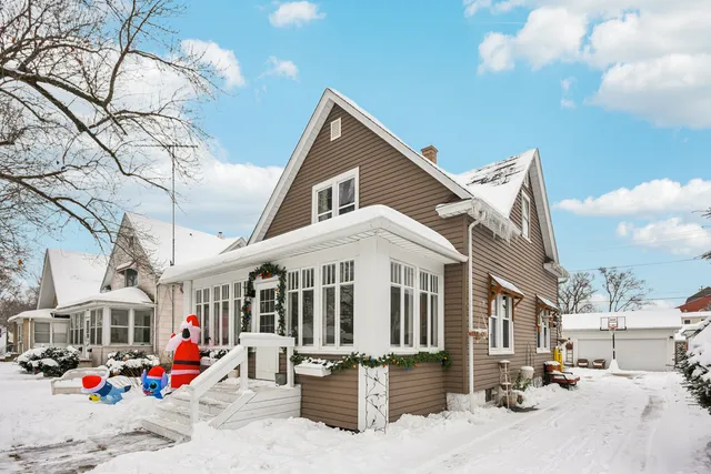 a view of the house with a yard