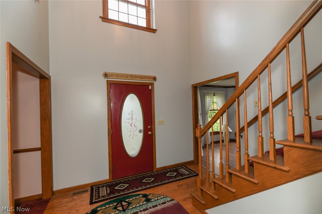 4634 Young Road Stow, OH 44224 - Photo 6 of 35 The impressive 2-story foyer greets you as you enter into the hardwood foyer. Living room is to the right and dining room to the left in this photo