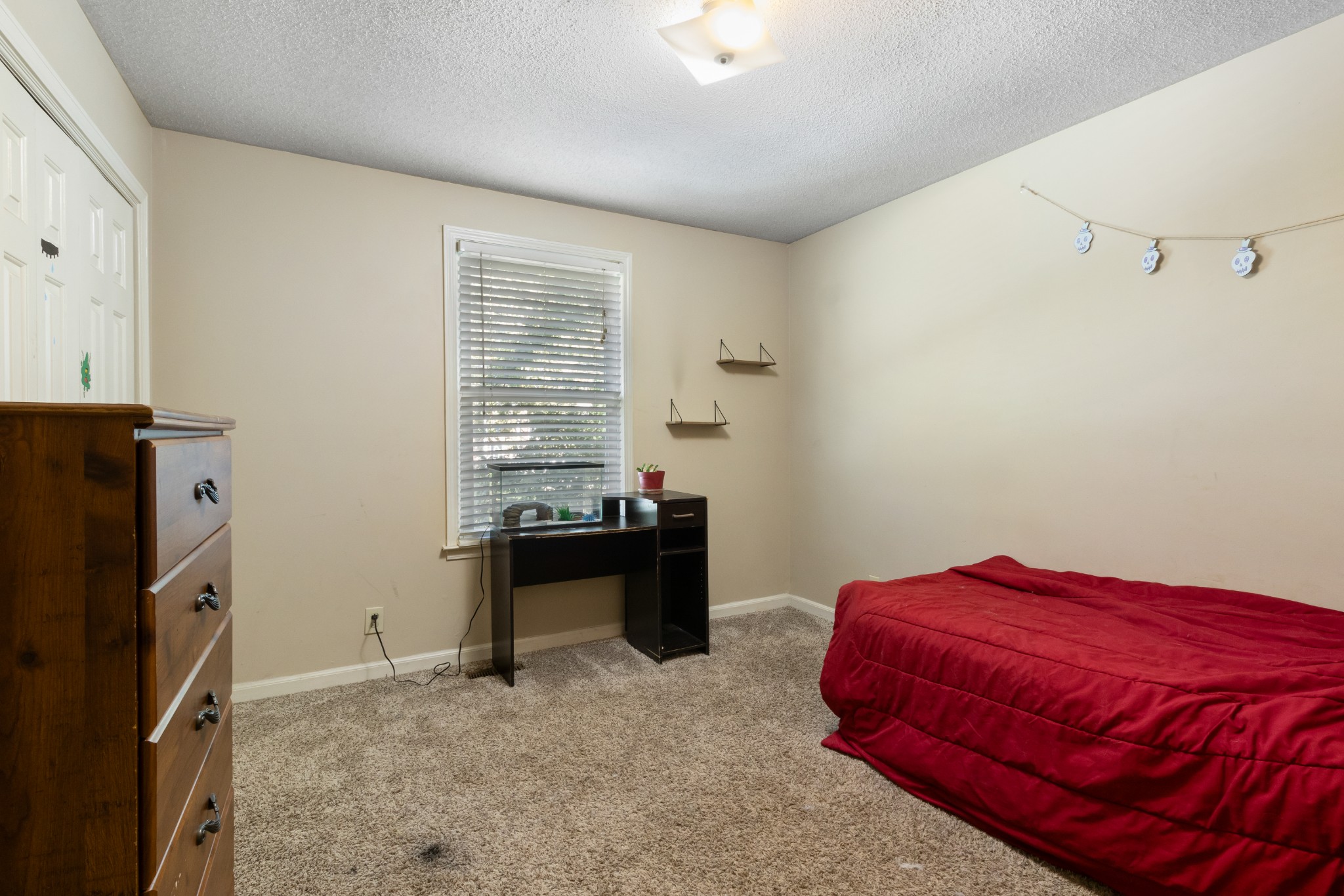 206 Pine Mountain Road Clarksville, TN 37042 - Photo 12 of 17 a bedroom with a bed and a window