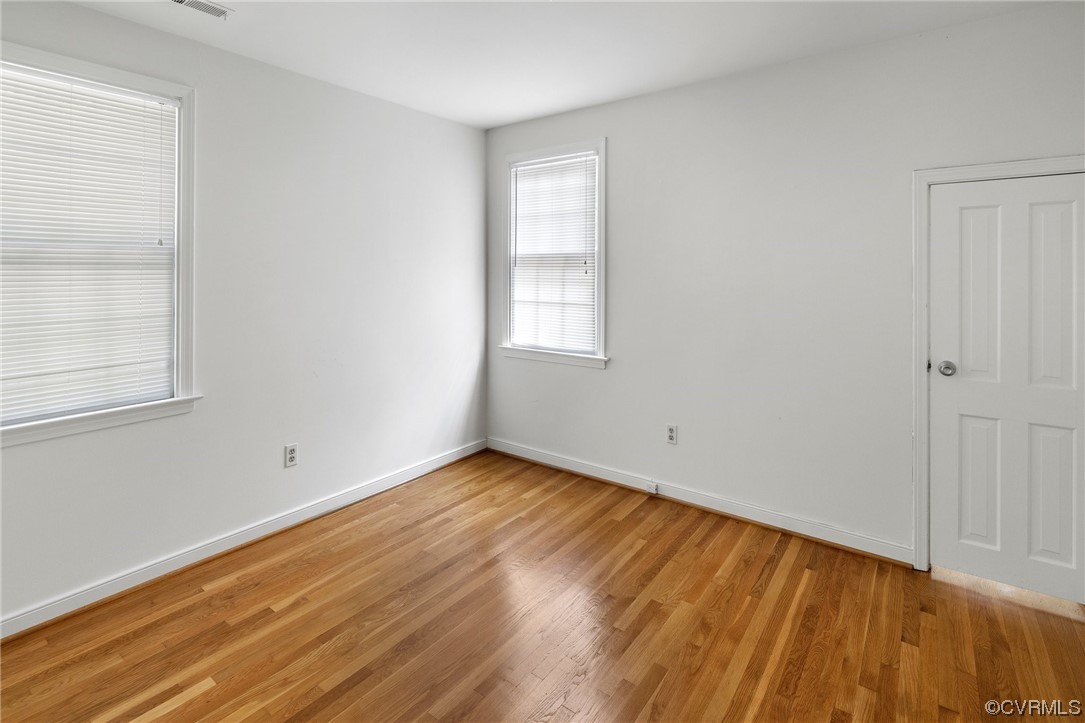 1513 Willingham Road Henrico, VA 23238 - Photo 32 of 40 a view of an empty room with wooden floor and a window