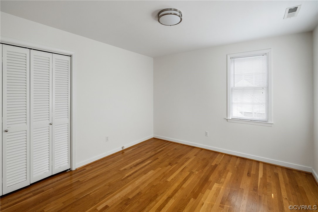 1513 Willingham Road Henrico, VA 23238 - Photo 37 of 40 an empty room with wooden floor and windows