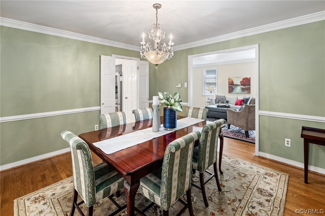 1513 Willingham Road Henrico, VA 23238 - Photo 10 of 40 a view of a dining room with furniture and chandelier
