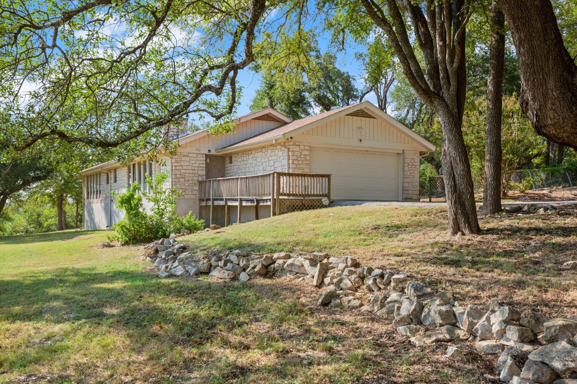 333 County Road 166 Georgetown, TX 78626 - Photo 11 of 36 a white house that has a tree in front of it