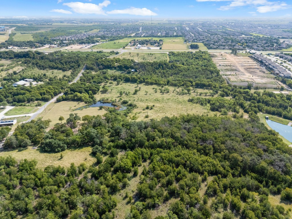 333 County Road 166 Georgetown, TX 78626 - Photo 32 of 36 an aerial view of residential houses with outdoor space and trees