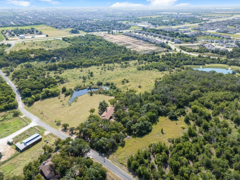 333 County Road 166 Georgetown, TX 78626 - Photo 33 of 36 an aerial view of residential houses with outdoor space and trees