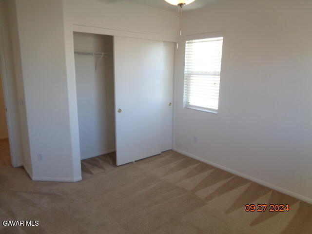 43660 Windrose Place Lancaster, CA 93536 - Photo 17 of 26 an empty room with windows