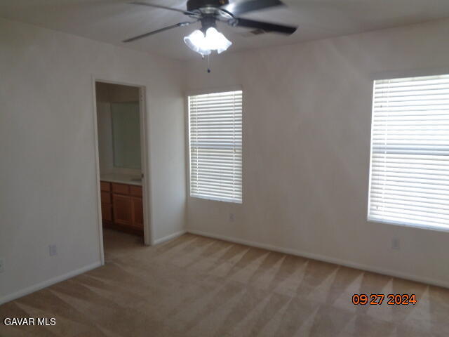 43660 Windrose Place Lancaster, CA 93536 - Photo 19 of 26 a view of an empty room with a window