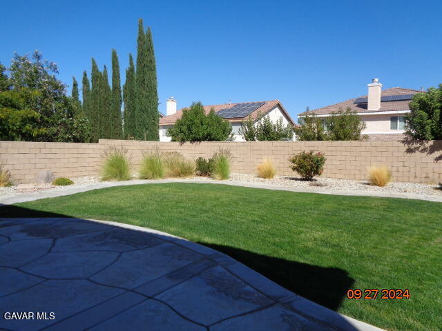 43660 Windrose Place Lancaster, CA 93536 - Photo 25 of 26 a view of green field with house in the background