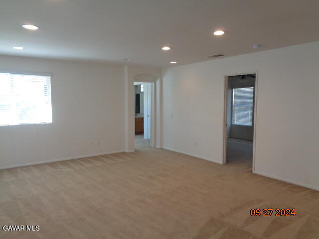 43660 Windrose Place Lancaster, CA 93536 - Photo 10 of 26 an empty room with windows and closet
