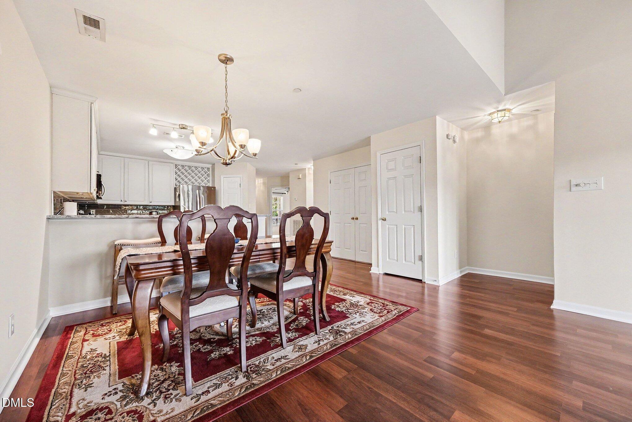132 Springfork Drive Cary, NC 27513 - Photo 14 of 28 a view of a a dining room with furniture window and wooden floor