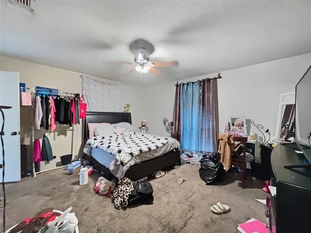 a bedroom with bed and a large closet