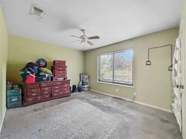 a bed room with a bed and a window