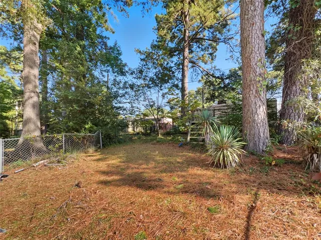 a backyard of a house with lots of green space