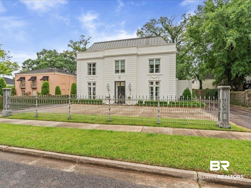 109 Eaton Square Mobile, AL 36608 - Photo 21 of 26 Stately white facade featuring multiple windows and a prominent entrance