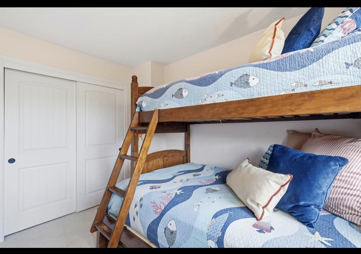 229 Rio Del Mar Boulevard Aptos, CA 95003 - Photo 11 of 27 a bedroom with a bed and wooden floor