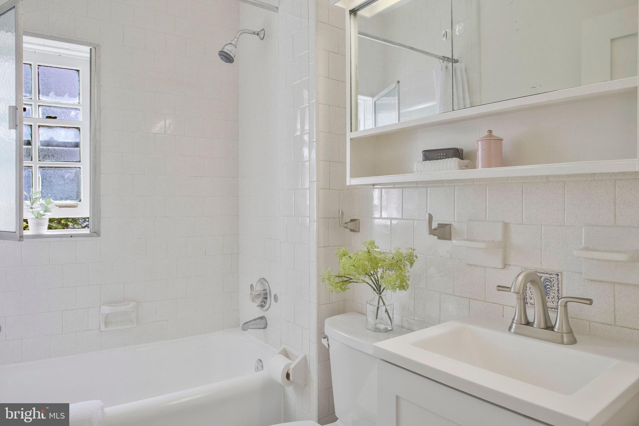 3024 North Calvert Street, Unit A1 Baltimore, MD 21218 - Photo 27 of 41 Beautifully updated and bright bathroom.
