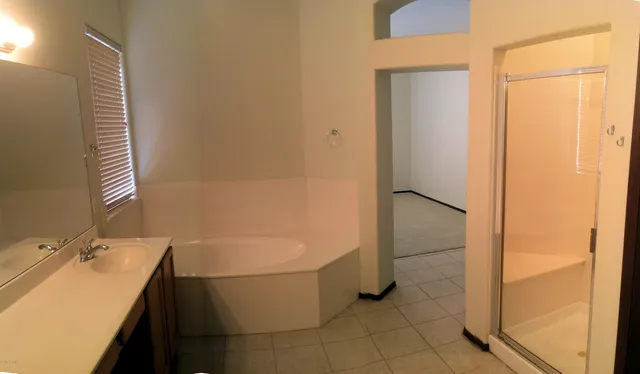 a bathroom with a bathtub and a sink