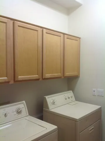 a view of a house with potted plants