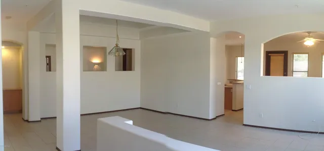 a view of a hallway with some storage and utility room