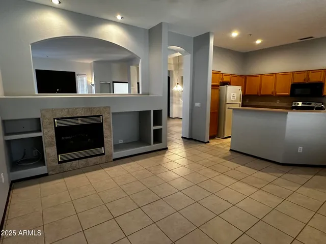 a view of a kitchen with furniture and a fireplace