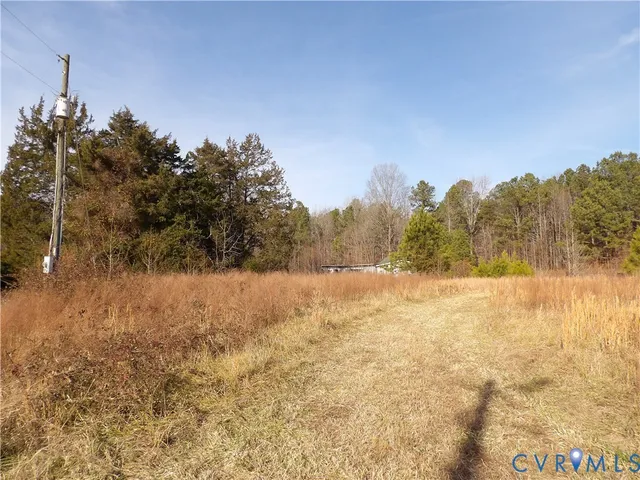 a view of mountain view with trees in the background