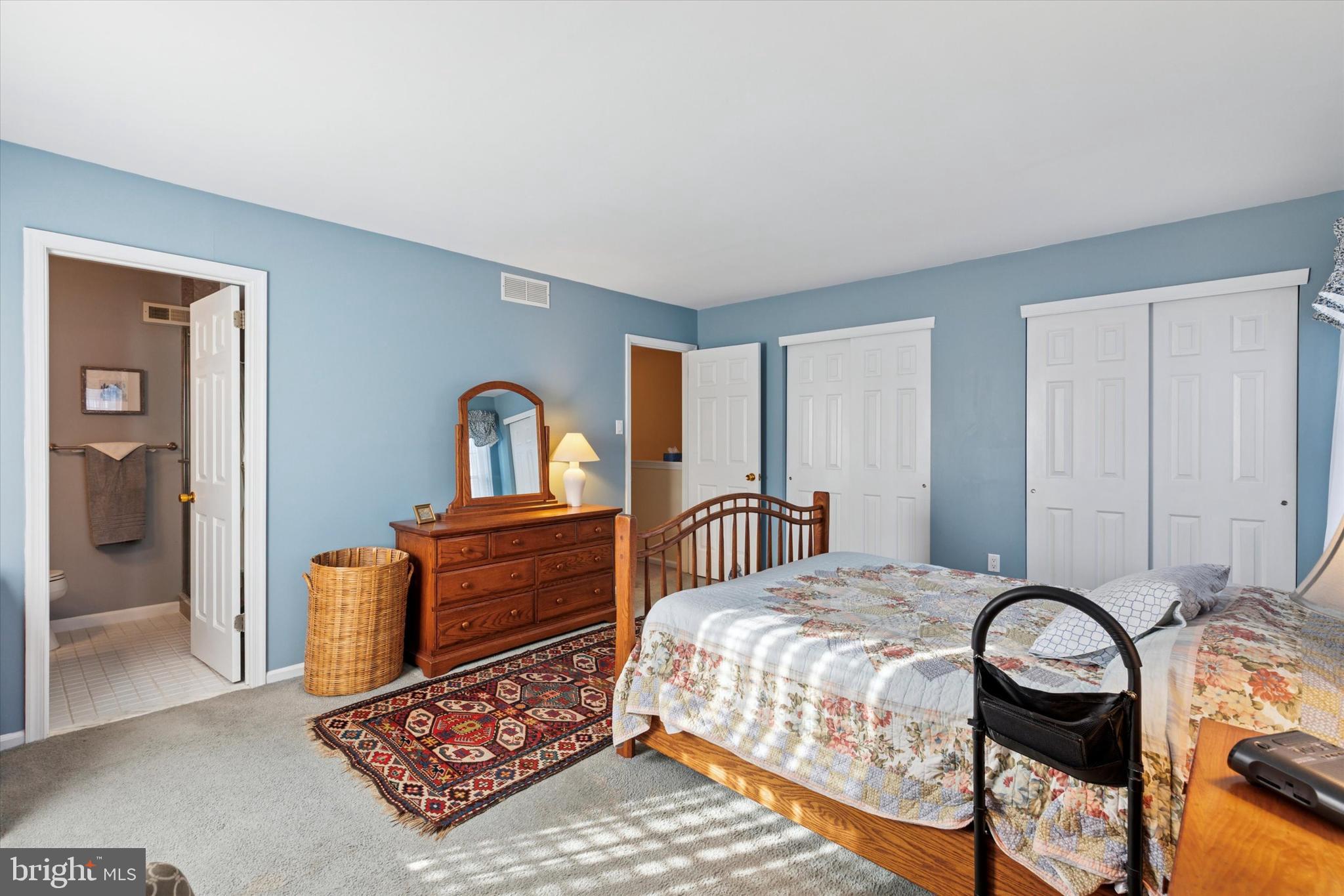 2300 Navajo Path Ambler, PA 19002 - Photo 14 of 25 a bedroom with a bed and a dresser with mirror