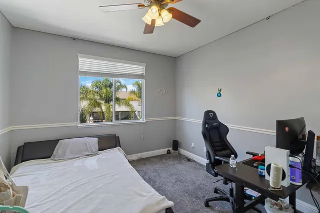 a bedroom with a workspace