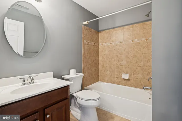 a view of washer and dryer with kitchen in the background