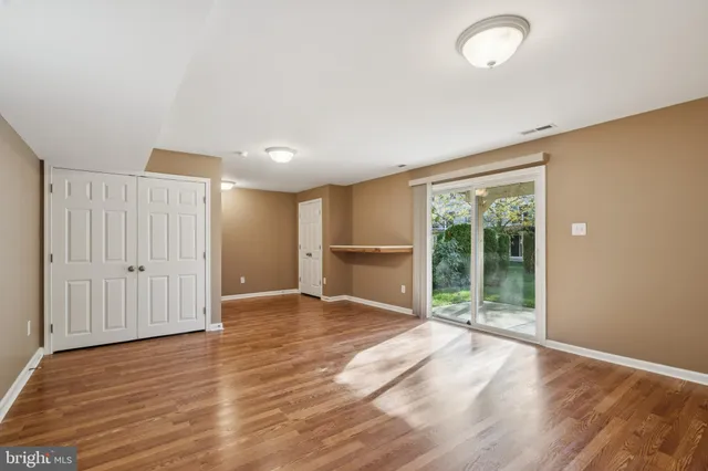 a view of a balcony with wooden floor and fence