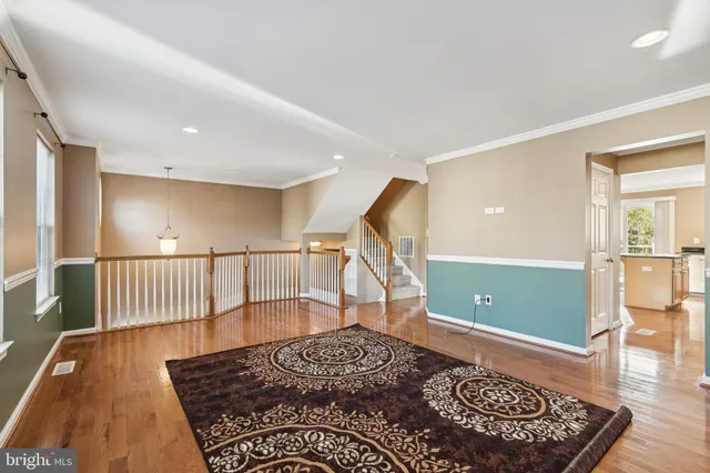 a view of room with window and ceiling fan