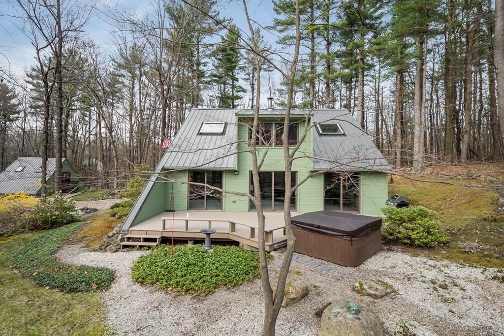 25 Hog Hill Road Pepperell, MA 01463 - Photo 2 of 34 a front view of a house with a yard