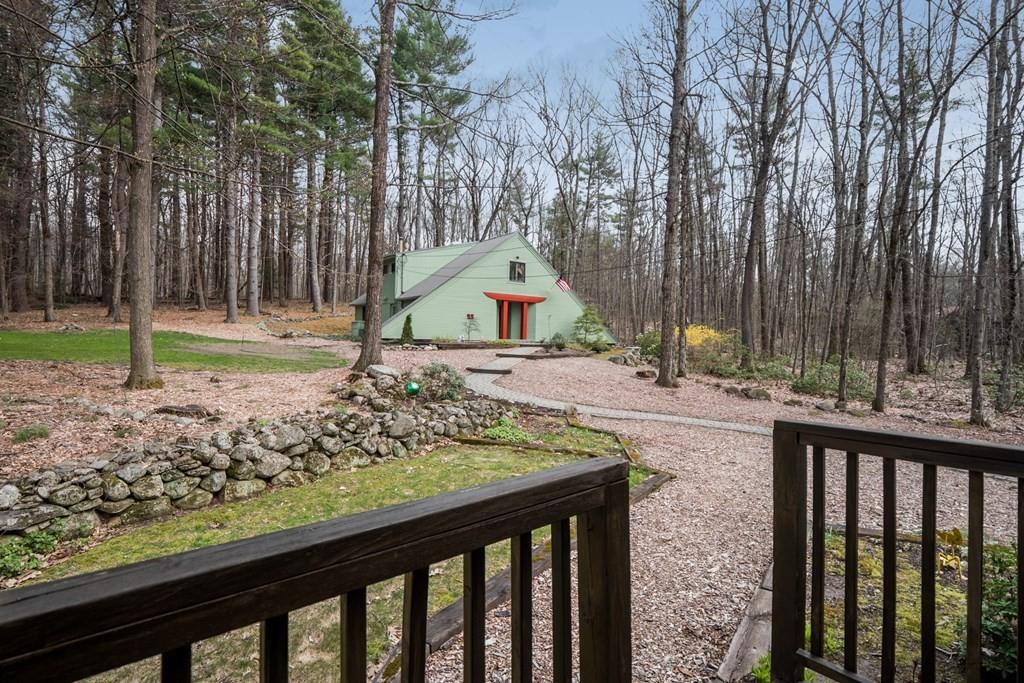 25 Hog Hill Road Pepperell, MA 01463 - Photo 31 of 34 a park view with large trees and wooden fence